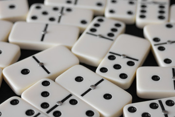 White domino pieces with black dots.
