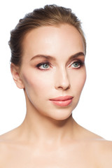 Obraz premium beautiful young woman face over white background