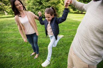 Fototapeta premium happy family walking in summer park and having fun