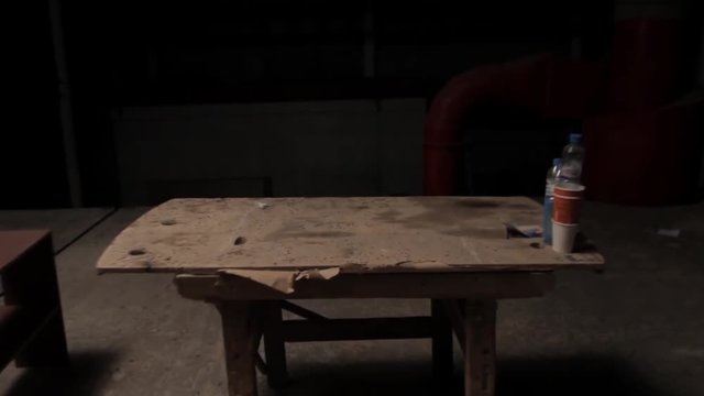 Old wooden table in a dark room