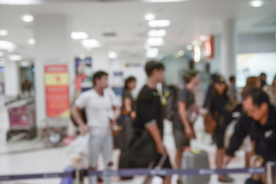 Abstract blur image of people walk in the airport 