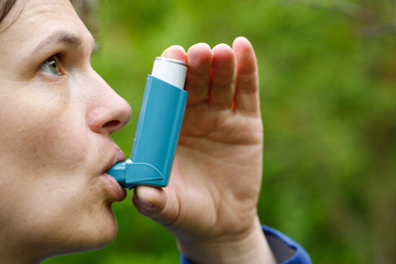 Asthma patient inhaling medication