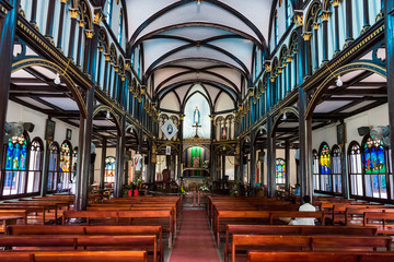 Inside Wooden Church of Kon Tum. Inside of the historical wooden church in Kon Tum, Vietnam. Built...