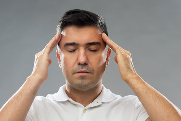 man suffering from head ache or thinking