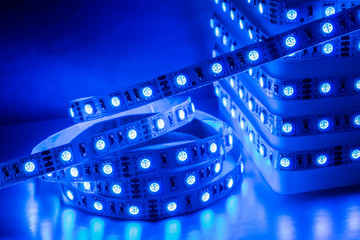 Diodes LED Strip color in the rainbow RGB stripes background blur