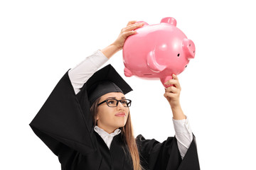 Worried graduate student shaking a piggybank