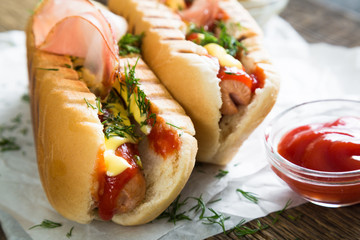 Hot dogs on a wooden table