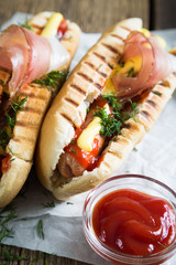 Hot dogs on a wooden table
