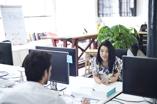 Young asian woman at an office desk