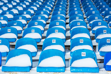 Background chairs at stadium , winter
