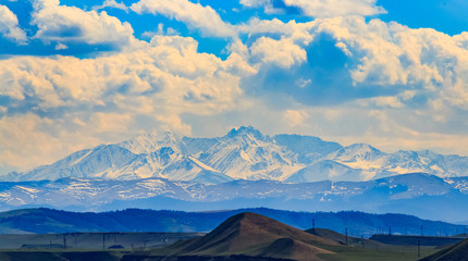 Beautiful clouds over the snowy peaks.