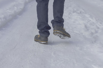 People walking through the snow in the morning near