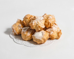 Small eclairs on a white background.