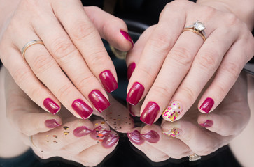 Amazing manicure and natural nails with gel polish. Attractive modern nail art design.