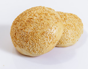 Wheat bread with sesame on white background.