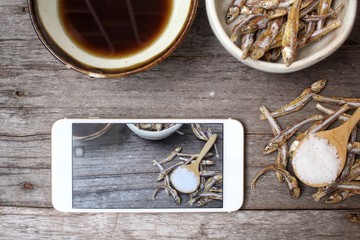 Taking a photo of fish sauce with smart phone