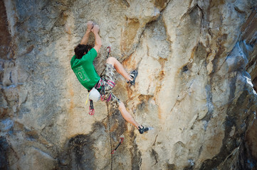 man climbing a wall