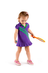 Little cute girl playing tennis on a white background