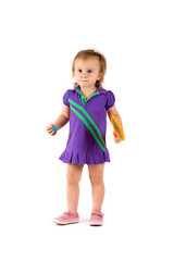 Little cute girl playing tennis on a white background