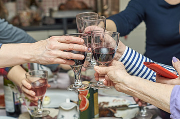  People clinking glasses at festive table   