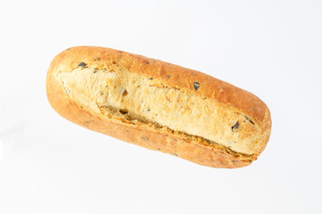 oval bread on a white background top view. European bread loaf of wheat flour with the addition of olive slices.