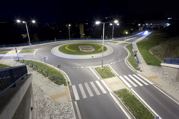 Fototapeta na wymiar modern traffic roundabout at night, Banska Bystrica, Slovakia