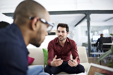 Man gesturing at business meeting