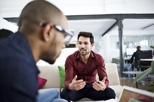 Man Gesturing At Business Meeting