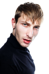 Fototapeta premium handsome young man in black jumper posing in studio