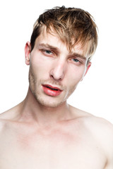 handsome shirtless young man posing in studio