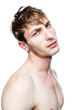 handsome shirtless young man posing in studio