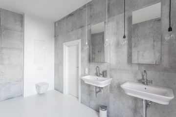 Spacious white bathroom with sinks