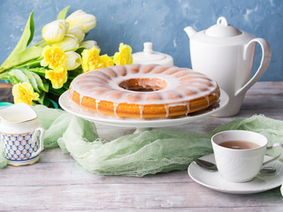 Bundt cake with sugar frosting. Spring breakfast set. Easter festive treat