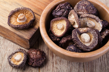 dried shitake mushroom on a wooden table