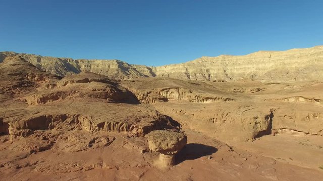 Desert landscape at Timna park - Aerial footage of Timna park, including the Mushroom, surrounded by copper ore smelting sites from between the 14th and 12th centuries BCE