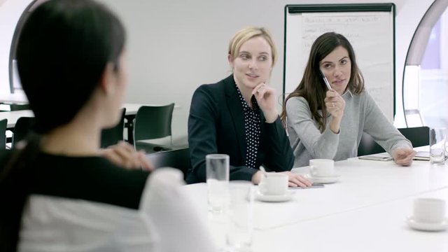 Women Working Together in meeting room