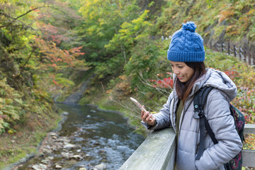 Woman using cellphone to send text message