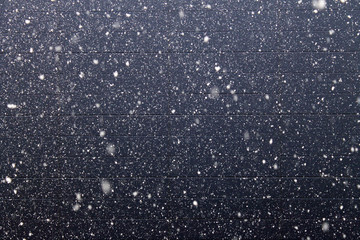 Snow fall on the purple wall background