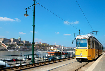 Historical tram runs on the riverside in Budapest