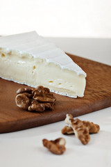 Brie Cheese on Cutting Board with Walnuts