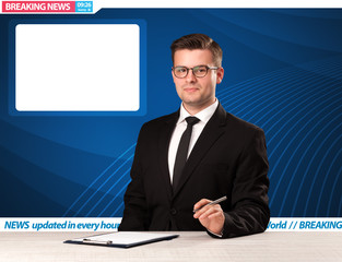 Television reporter telling breaking news at his studio desk wit