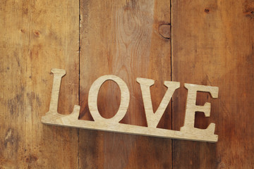 Top view of word LOVE from wooden letters