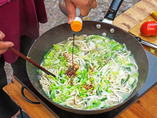 Traditional Chinese noodles at the market. Conceptually, the noodle is the main food of poor people in Asia.