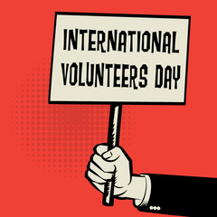 Poster in hand, business concept International Volunteers Day