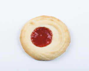 Delicious cookie with berry jam topping. Horizontal studio shot.
