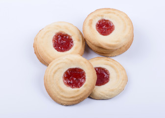 Delicious cookies with berry jam topping. Horizontal studio shot.