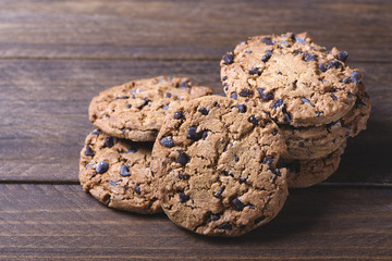Delicious cookies placed on wooden table. Horizontal studio shot.