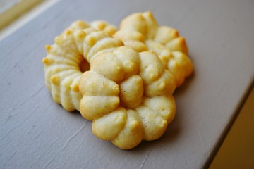 Homemade flower shaped butter cookies made with a cookie press