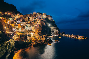 Fototapeta na wymiar Night view of Manarola fishing village in Cinque Terre, Italy