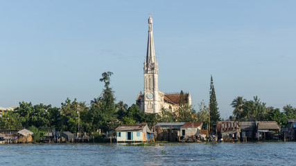 Fototapeta na wymiar Mekong, Vietnam - November 29, 2015: The Catholic Church in Mekong Delta, Vietnam. Mekong Delta is the region in southwestern Vietnam where the Mekong River approaches.